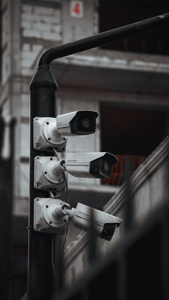 pexels photo 27765780 Array of security cameras on a building post, highlighting surveillance and urban security.